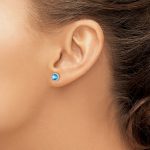 Sterling Silver Rhodium-plated Blue Topaz and CZ Post Earrings